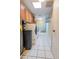 Laundry room with washer, dryer, and ample shelving at 10423 W Wheatridge Dr, Sun City, AZ 85373