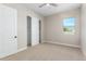 Bedroom with carpet, ceiling fan, and sliding closet doors at 5170 N 186Th Dr, Litchfield Park, AZ 85340