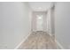 Bright entryway with light wood-look flooring and neutral walls at 5170 N 186Th Dr, Litchfield Park, AZ 85340