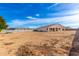Spacious backyard with view of house at 5170 N 186Th Dr, Litchfield Park, AZ 85340
