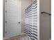 Bathroom with shower/tub combo and striped shower curtain at 5170 N 186Th Dr, Litchfield Park, AZ 85340