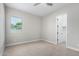 Bright bedroom with a window and closet space at 5170 N 186Th Dr, Litchfield Park, AZ 85340
