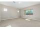 Bright bedroom with neutral walls and carpeting, offering ample space at 5170 N 186Th Dr, Litchfield Park, AZ 85340