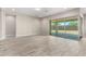 Living area with sliding glass doors leading to the backyard patio at 5170 N 186Th Dr, Litchfield Park, AZ 85340