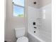 Simple bathroom with shower/tub combo and window at 5170 N 186Th Dr, Litchfield Park, AZ 85340
