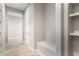 Hallway with built-in bench and shelving at 5170 N 186Th Dr, Litchfield Park, AZ 85340