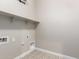 Well-appointed laundry room with shelving and tile floor at 5170 N 186Th Dr, Litchfield Park, AZ 85340