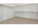 Spacious walk-in closet with ample shelving and hanging rods at 5170 N 186Th Dr, Litchfield Park, AZ 85340