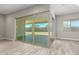 Spacious backyard patio accessible through sliding glass doors at 5170 N 186Th Dr, Litchfield Park, AZ 85340