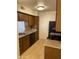 Efficient kitchen featuring wood cabinets, granite countertops, and modern appliances at 3500 N Hayden Rd # 1903, Scottsdale, AZ 85251