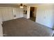 Living room with carpet, mirrored closet doors and access to patio at 3500 N Hayden Rd # 1903, Scottsdale, AZ 85251