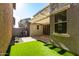 Private backyard with covered patio and artificial turf at 2772 S Betty St, Gilbert, AZ 85295