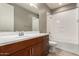 Clean bathroom with tub, vanity, and tiled floor at 2772 S Betty St, Gilbert, AZ 85295