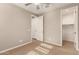 Bright bedroom with ceiling fan and private closet at 2772 S Betty St, Gilbert, AZ 85295