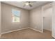 Bright bedroom with ceiling fan and adjacent closet at 2772 S Betty St, Gilbert, AZ 85295