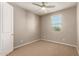 Comfortable bedroom featuring a ceiling fan and window at 2772 S Betty St, Gilbert, AZ 85295