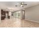 Open dining area with wood-look tile floors and view into the kitchen and backyard at 2772 S Betty St, Gilbert, AZ 85295