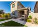 Two-story house with gray siding, stone accents, and a landscaped front yard at 2772 S Betty St, Gilbert, AZ 85295