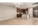 Modern kitchen with dark brown cabinets, granite countertops, and stainless steel appliances at 2772 S Betty St, Gilbert, AZ 85295