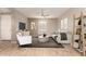 Living room featuring wood-look tile floors, ceiling fan, and stylish furniture at 2772 S Betty St, Gilbert, AZ 85295