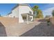 Spacious backyard with gravel and a covered patio at 355 W Jersey Way, San Tan Valley, AZ 85143