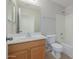 Clean bathroom with a tub, shower, and wood vanity at 355 W Jersey Way, San Tan Valley, AZ 85143