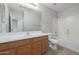 Bathroom with a tub, shower, and wood vanity at 355 W Jersey Way, San Tan Valley, AZ 85143