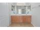 Double vanity bathroom with light wood cabinets at 355 W Jersey Way, San Tan Valley, AZ 85143
