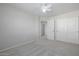 Spacious bedroom with double doors leading to the next room at 355 W Jersey Way, San Tan Valley, AZ 85143