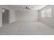 Spacious carpeted bedroom with ceiling fan and window at 355 W Jersey Way, San Tan Valley, AZ 85143