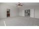 Large bedroom with carpet, doors to hallway and bathroom at 355 W Jersey Way, San Tan Valley, AZ 85143