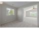 Cozy bedroom with a large window and neutral decor at 355 W Jersey Way, San Tan Valley, AZ 85143