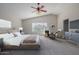 Spacious bedroom with carpeted floor and ceiling fan at 355 W Jersey Way, San Tan Valley, AZ 85143