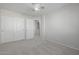 Well-lit bedroom featuring double closets and carpet flooring at 355 W Jersey Way, San Tan Valley, AZ 85143