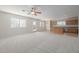 Kitchen with light wood cabinets, island, and stainless steel appliances at 355 W Jersey Way, San Tan Valley, AZ 85143