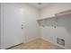 Laundry room with shelving and a door at 355 W Jersey Way, San Tan Valley, AZ 85143