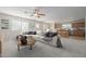 Open living room features a spacious layout, large windows, and neutral color palette at 355 W Jersey Way, San Tan Valley, AZ 85143