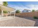 Covered patio and a small backyard with gravel at 355 W Jersey Way, San Tan Valley, AZ 85143