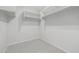 Large walk-in closet with shelves and hanging rods at 355 W Jersey Way, San Tan Valley, AZ 85143