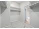 Spacious walk-in closet with built-in shelving at 355 W Jersey Way, San Tan Valley, AZ 85143