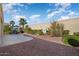 Landscaped backyard with a water feature at 13766 W Junipero Dr, Sun City West, AZ 85375