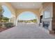 Clubhouse patio with fireplace and golf course view at 13766 W Junipero Dr, Sun City West, AZ 85375