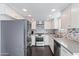 Updated kitchen, featuring stainless steel appliances and stylish backsplash at 7132 N 63Rd Dr, Glendale, AZ 85301