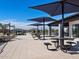 Community patio with tables, umbrellas, and seating at 3187 E Hayden Rose Ave, San Tan Valley, AZ 85143