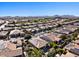Aerial view of a luxury community with golf course and mountain views at 856 E Harmony Way, San Tan Valley, AZ 85140