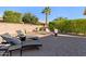 Private backyard oasis with fire pit and lounge chairs at 856 E Harmony Way, San Tan Valley, AZ 85140