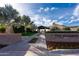 The Algarve community entrance with palm trees and a brick sign at 856 E Harmony Way, San Tan Valley, AZ 85140
