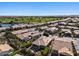Aerial view of community, highlighting golf course and residential homes at 856 E Harmony Way, San Tan Valley, AZ 85140