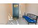 Front entry with a dark blue door, a bench, and a welcome mat at 856 E Harmony Way, San Tan Valley, AZ 85140