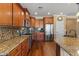 Spacious kitchen with granite countertops, stainless steel appliances, and wood cabinetry at 856 E Harmony Way, San Tan Valley, AZ 85140